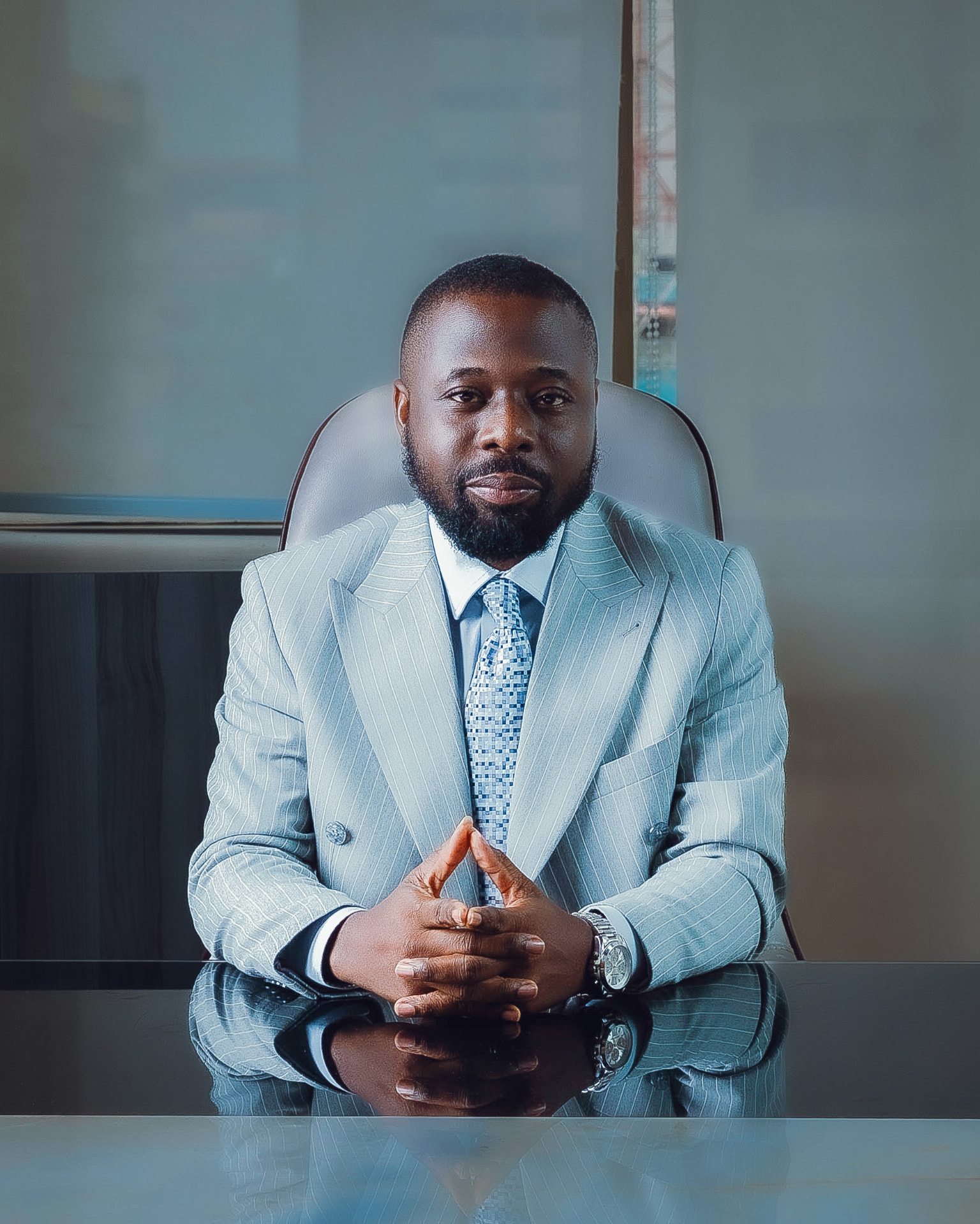 Chrysolyte Egonu at his desk